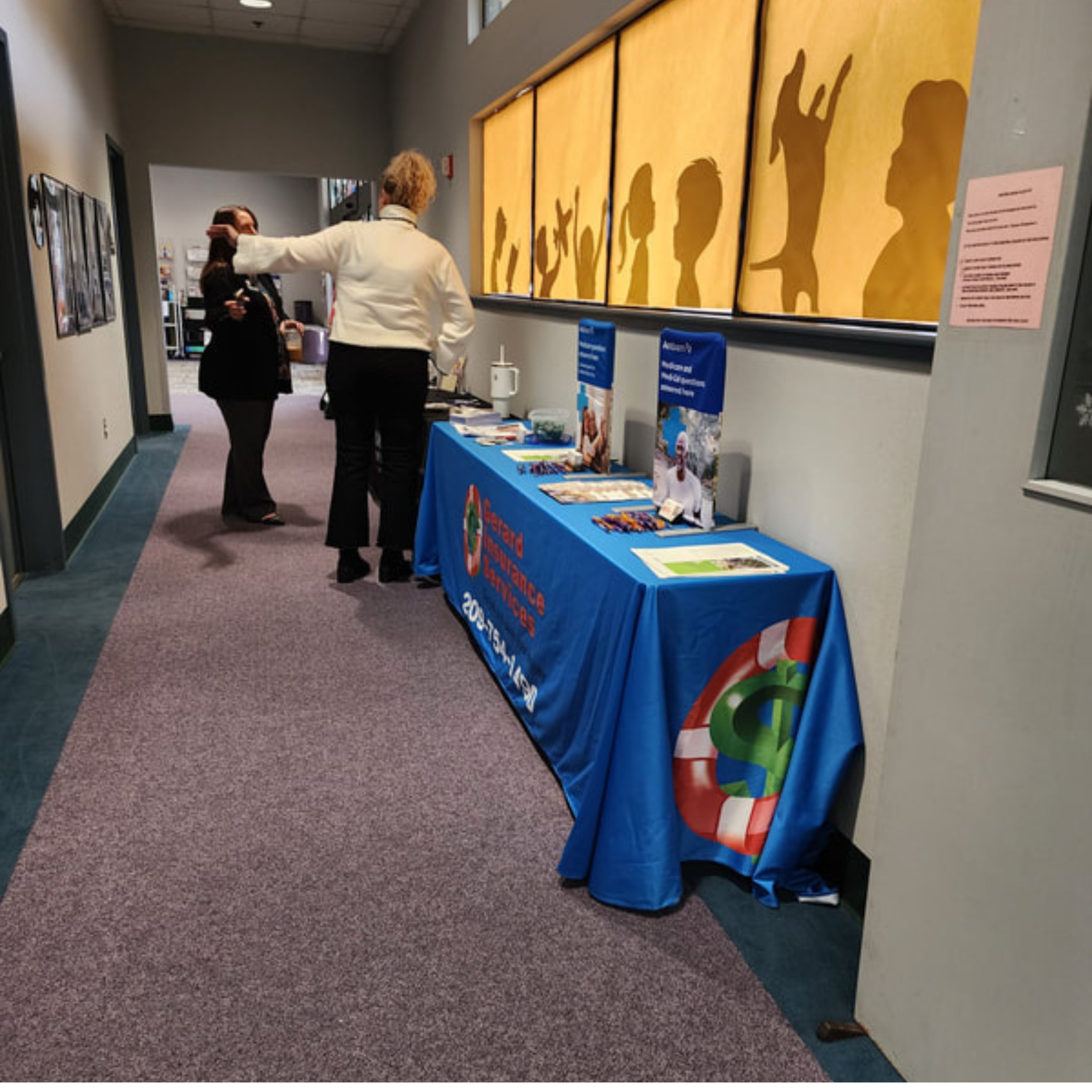 Bristol Hospice Gerard Insurance Services booth with flyers and at the Bristol Hospice.